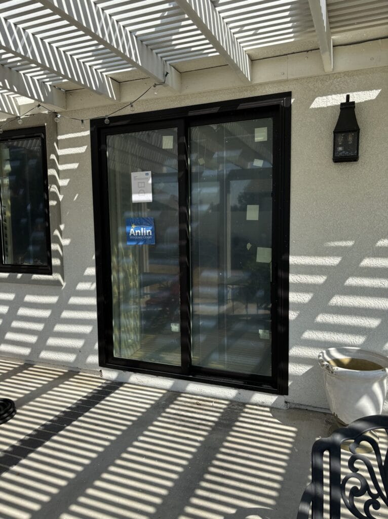 energy-efficient patio sliding door with black vinyl frame in Rancho Cucamonga